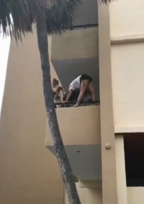 The woman was filmed performing what appears to be yoga poses on a balcony in Pompano Beach. (Facebook / John Krobatsch)