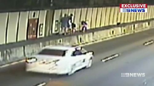 The pair managed to climb a barrier before Transurban officers picked them up.