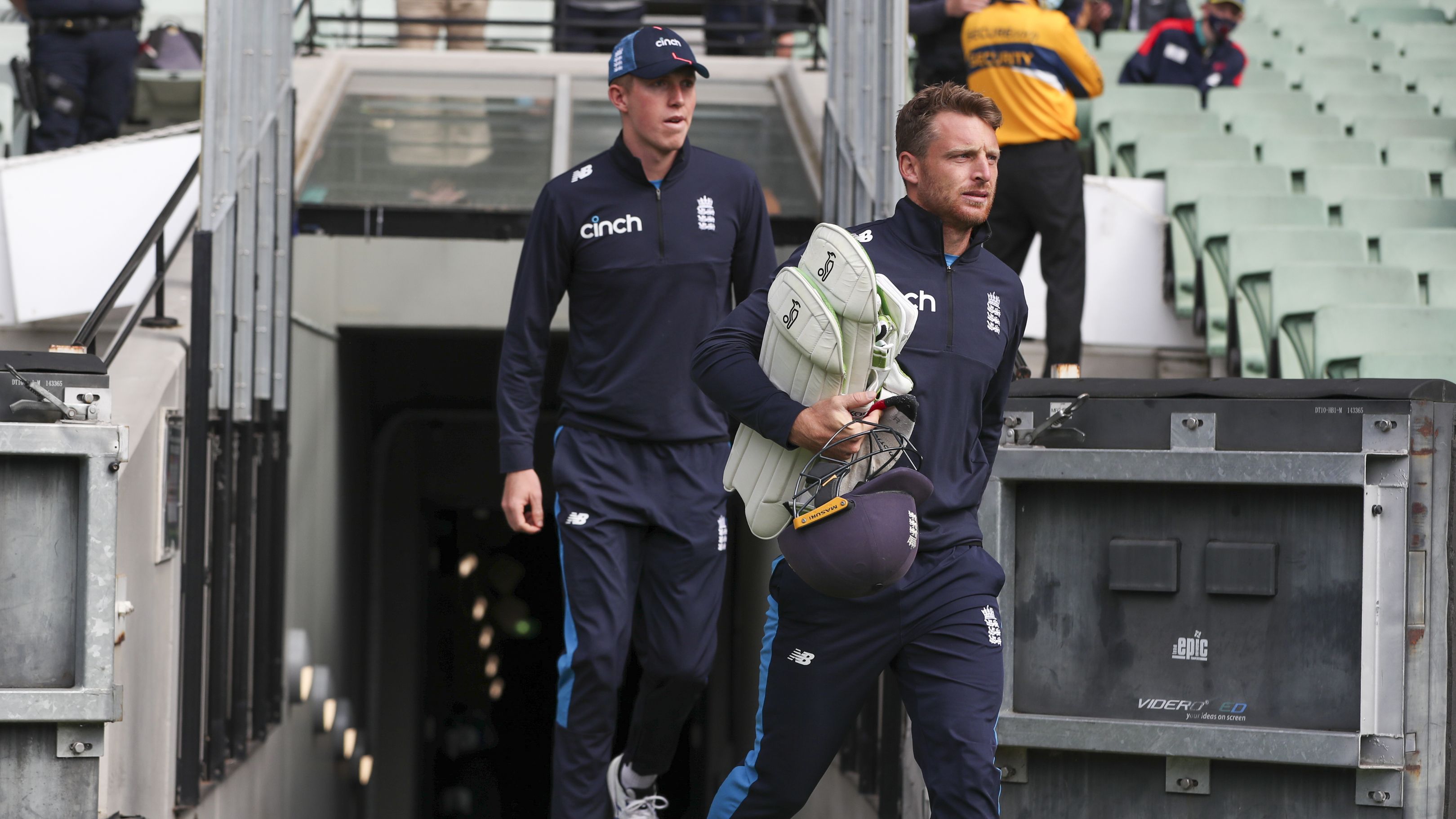 England&#x27;s Jos Buttler, right, and Zak Crawley arrive at the Melbourne Cricket Ground.