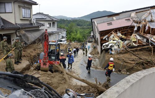 Easing rain has allowed the search for survivors to begin. Picture: AP