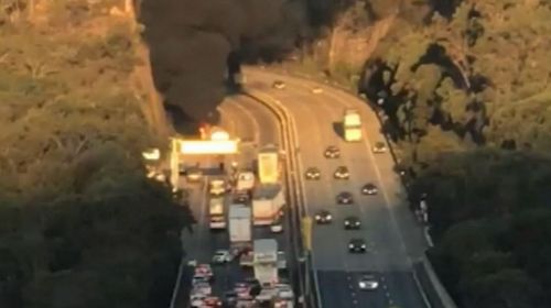 Smoke could be seen billowing up from the crash site. Image: 9News