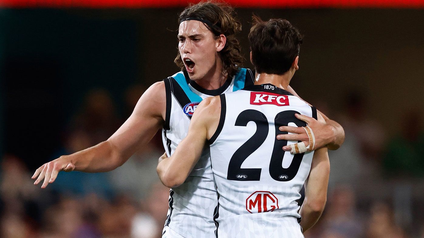 Port Adelaide forward Ollie Lord celebrates a goal with Connor Rozee.
