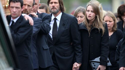 Carrey attended the funeral with his daughter Jane (right). (AAP)