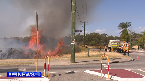 The Kenwick fire broke out about midday (AWST) and has since burned along Boundary Road and into the Kenwick Wetlands.