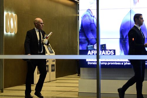 Australian Federal Police (AFP) investigators leave the main entrance to the ABC building located at Ultimo in Sydney, Wednesday, June 5, 2019. 