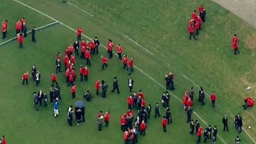 Students have been moved to the oval while authorities deal with the threat (9NEWS)