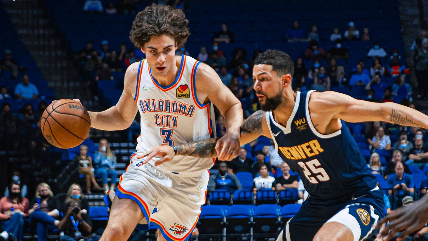  Josh Giddey #3 of the Oklahoma City Thunder drives to the basket against the Denver Nuggets during a preseason game