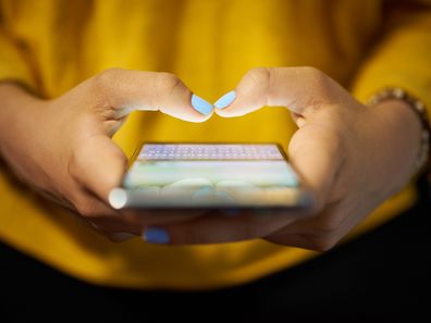 Woman texting on phone