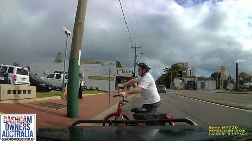 The cyclist was visibly stunned but was able to stand unassisted. (Dashcam Owners Australia)