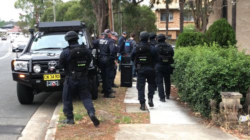Police at the scene were heavily protected. (NSW Police)