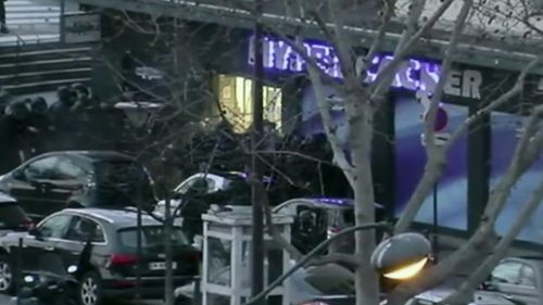 Police surround the Kosher supermarket stormed by Coulibaly in January. (9NEWS)