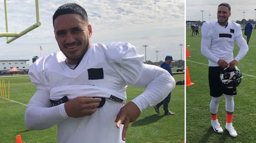 Valentine Holmes tries on the pads for size at Florida’s IMG Academy.