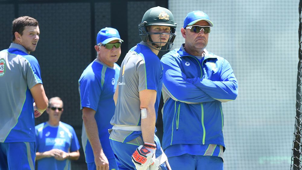 Steve Smith and Darren Lehmann watch on at Australia training. (AAP)