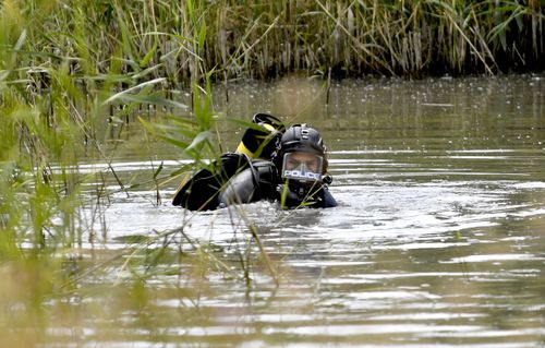 Police divers are searching for items including a hunting knife, a dark coloured jacket and gloves in the Christie Creek catchment.