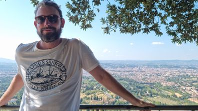 Brandon Livesay standing on hillside above Florence, Italy.