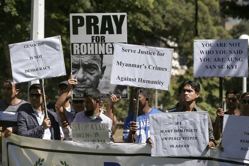 Protesters angry at the Rohingya atrocities stage a demo outside the ASEAN Summit. Picture: AAP