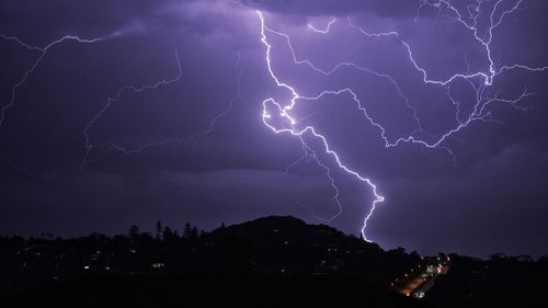 Lightning flashes across the sky as seen from Newport on Sydney's northern beaches.