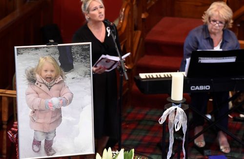 A file photo of last year's funeral of six-year-old Alesha MacPhail, whose body was found in woodland on a Scottish island.