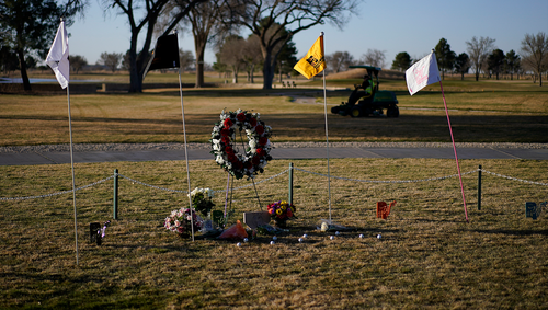 Workers prepare the course for the day near a makeshift memorial at the Rockwind Community Links Thursday, March 17, 2022, in Hobbs, N.M.. The memorial was for student golfers and the coach of University of the Southwest killed in a crash in Texas. (AP Photo/John Locher)
