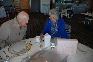 Ron and Daisy look at the menu