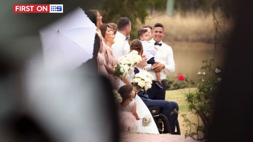 The radiant wedding party smiled for photographers. (9NEWS)