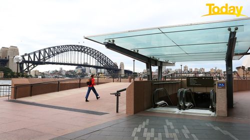 SYDNEY, AUSTRALIA - JUNE 24: A person walks along the Opera House forecourt on June 24, 2021 in Sydney, Australia. A steady increase in Covid-19 cases in Sydney prompted the government to impose greater restrictions including a mandatory mask mandate indoors and limits on gatherings and movement. Several Sydney suburbs have been declared federal Covid-19 hotspots. (Photo by Lisa Maree Williams/Getty Images)