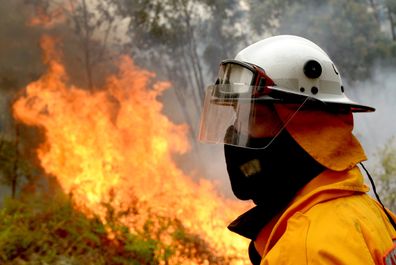 Firefighters backburn along Putty Road in Colo Heights in Sydney, Saturday, November 16, 2019. High temperatures, low humidity and gusty winds are threatening NSW this weekend, with severe fire danger ratings for regions in the north of the state. (AAP Image/Jeremy Piper) NO ARCHIVING