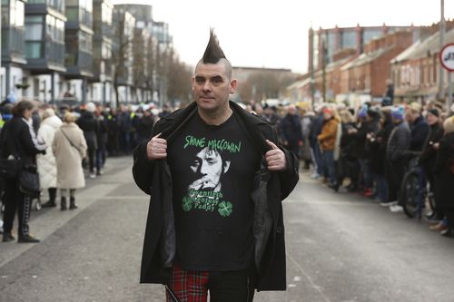 John Farrell outside Shelbourne Park Stadium in waits for the funeral procession of Shane MacGowan to makes its way through the streets of Dublin ahead of his funeral in Co Tipperary, in Ireland, Friday, Dec. 8, 2023. 