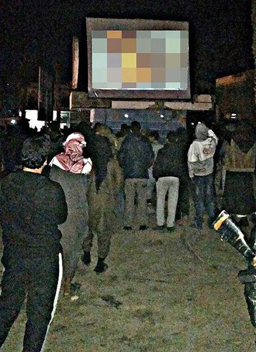 Australian jihadi and former business student Yusuf Yusuf joined a crowd in Raqqa to watch a public screening of the death of Jordanian pilot Moaz al-Kasasbeh. (Facebook)