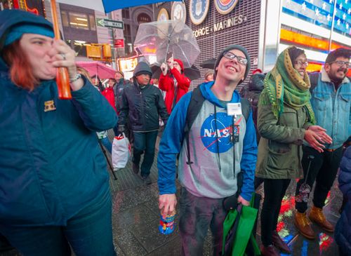 Space enthusiasts gathered in a chilly Times Square in New York to watch the Mars landing.