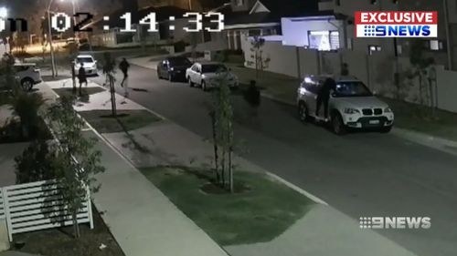 Ten youths were filmed descending on the suburban street at 2am on Christmas Eve.