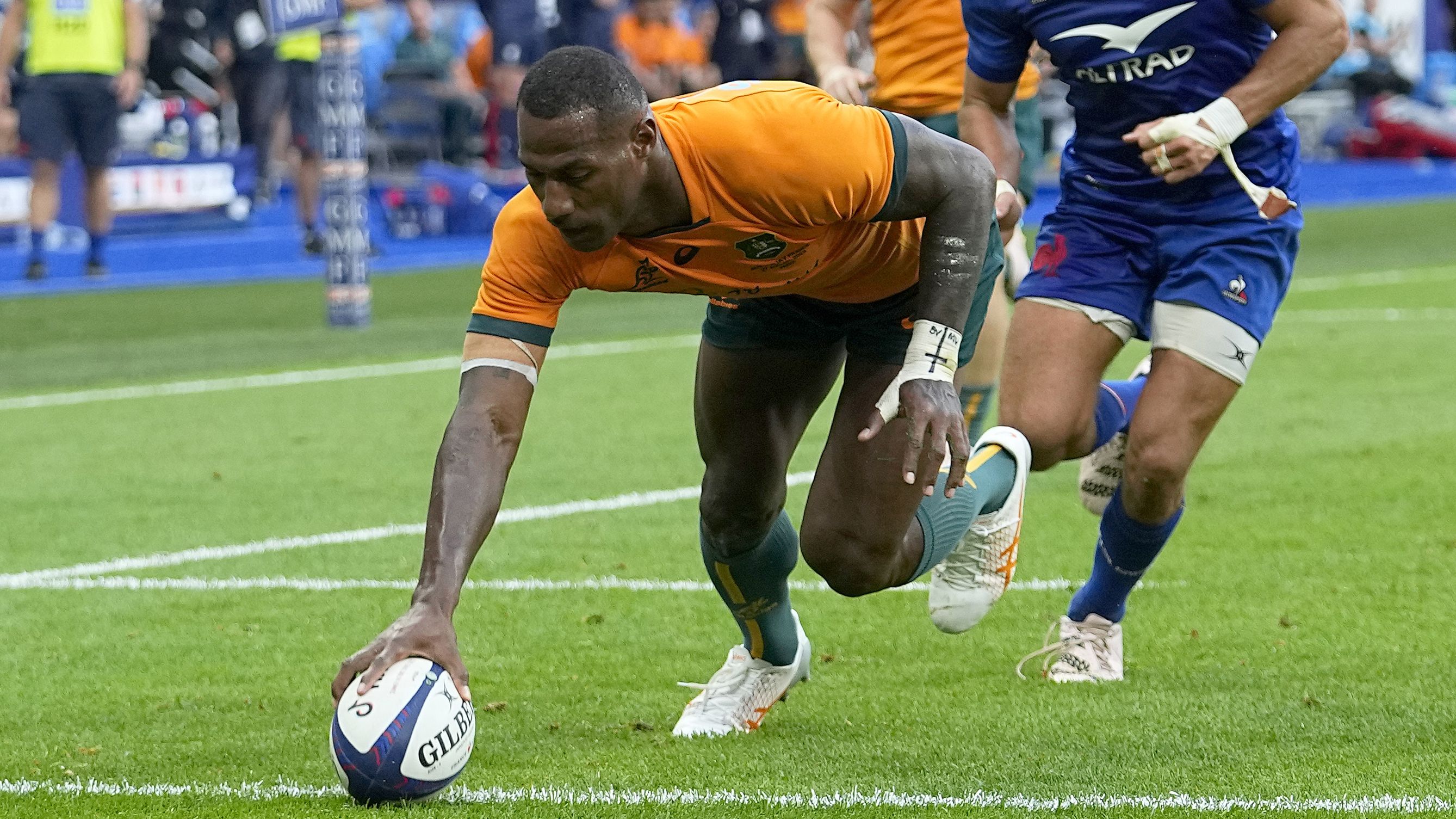 Australia&#x27;s Suliasi Vunivalu scores a try during a Rugby World Cup warm-up against France.