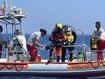 A firefighter cave diver as he prepares to reach the wrecked luxury superyacht Bayesian that sunk early Monday off the Sicilian coast in Porticciolo, in southern Italy on Friday, Aug. 23, 2024