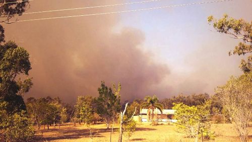 A grassfire threatens homes at Ravenshoe. (Twitter/WIN News)