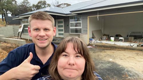Josh Girle-Bennett and his wife Michelle, pictured outside their almost completed first home in Orange, NSW.