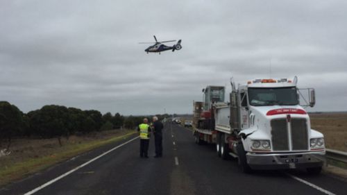 A police chopper surveys the scene. (9NEWS)