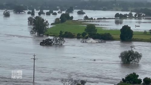 The raging floodwaters carried the couple's home downstream.