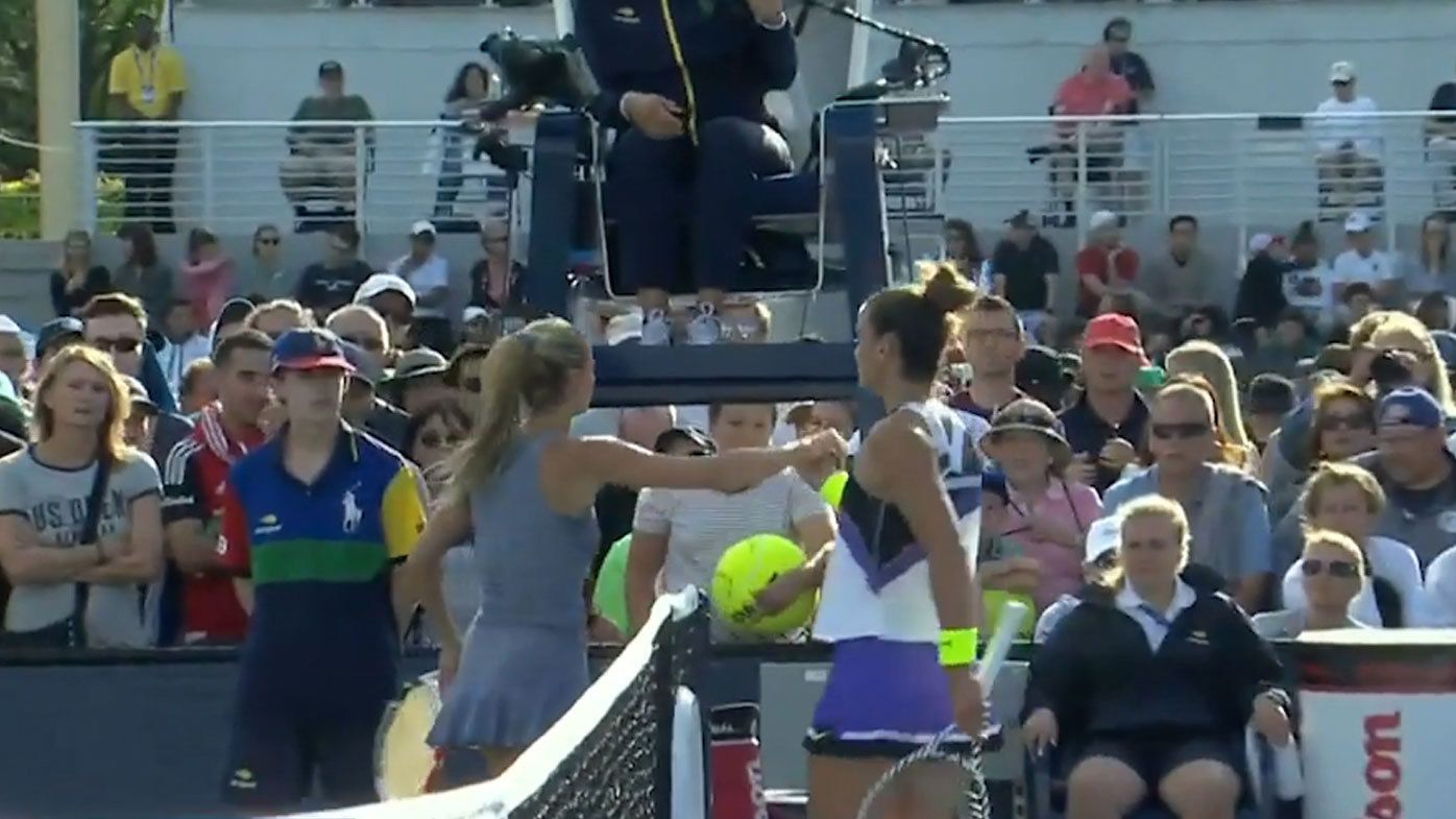 Maria Sakkari and Camilla Giorgi meet at the net after her win