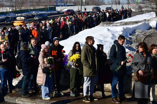 Mourners at the grave of Alexey Navalny at Borisovsky Cemetery in Moscow.