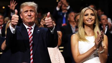 Donald Trump gives two thumbs up at the 2016 Republican National Convention as Ivanka Trump watches on and applauds.