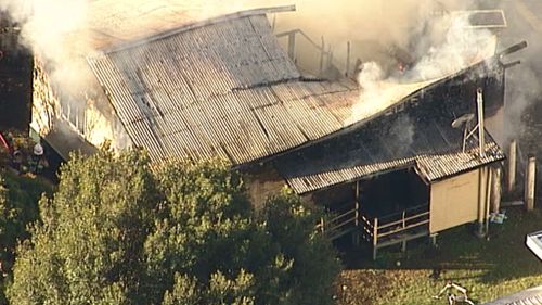 Thick smoke spewed from the roof. (9NEWS)