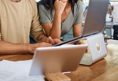 couple splitting costs moving in together