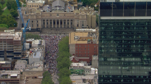 At times protesters shouted "free Victoria" and "sack Dan Andrews" as they marched. 