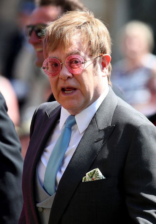 Elton John cut a dashing figure as he entered St George's Chapel. Picture: AAP