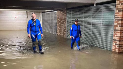 SES volunteers attend to a flooded basement in Canterbury. 