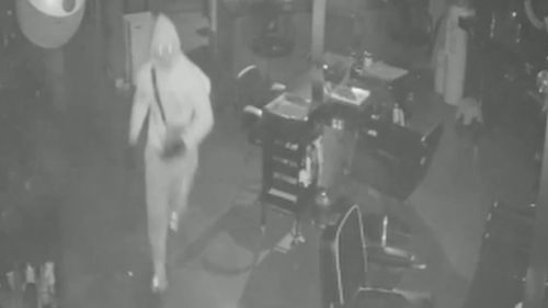 One of the thieves can be seen inside the salon.