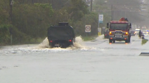 Floodwaters are seen in Ballina as water spills from saturated catchments. 