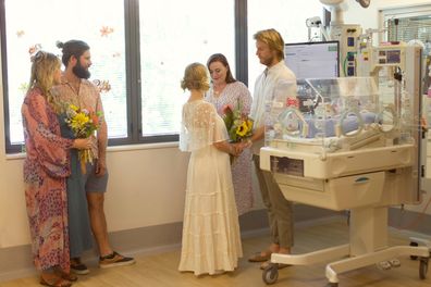 Alana and Angus got married in the NICU by their tiny baby's humidicrib