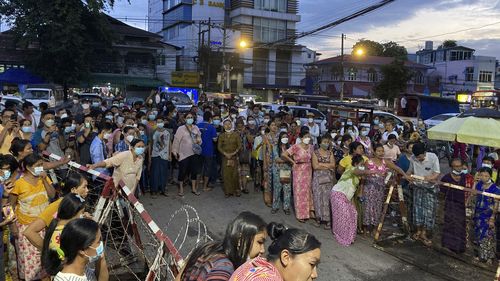 Family members wait for prisoners outside Insein Prison. 