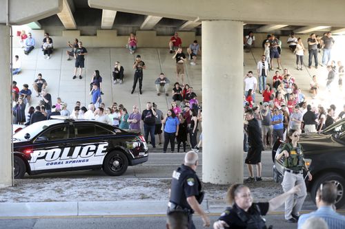 Hundreds of students were forced to evacuate the school and wait until the lockdown was over. (AAP)